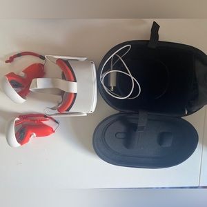 Meta Quest VR headset with red and original cover and additional carry case